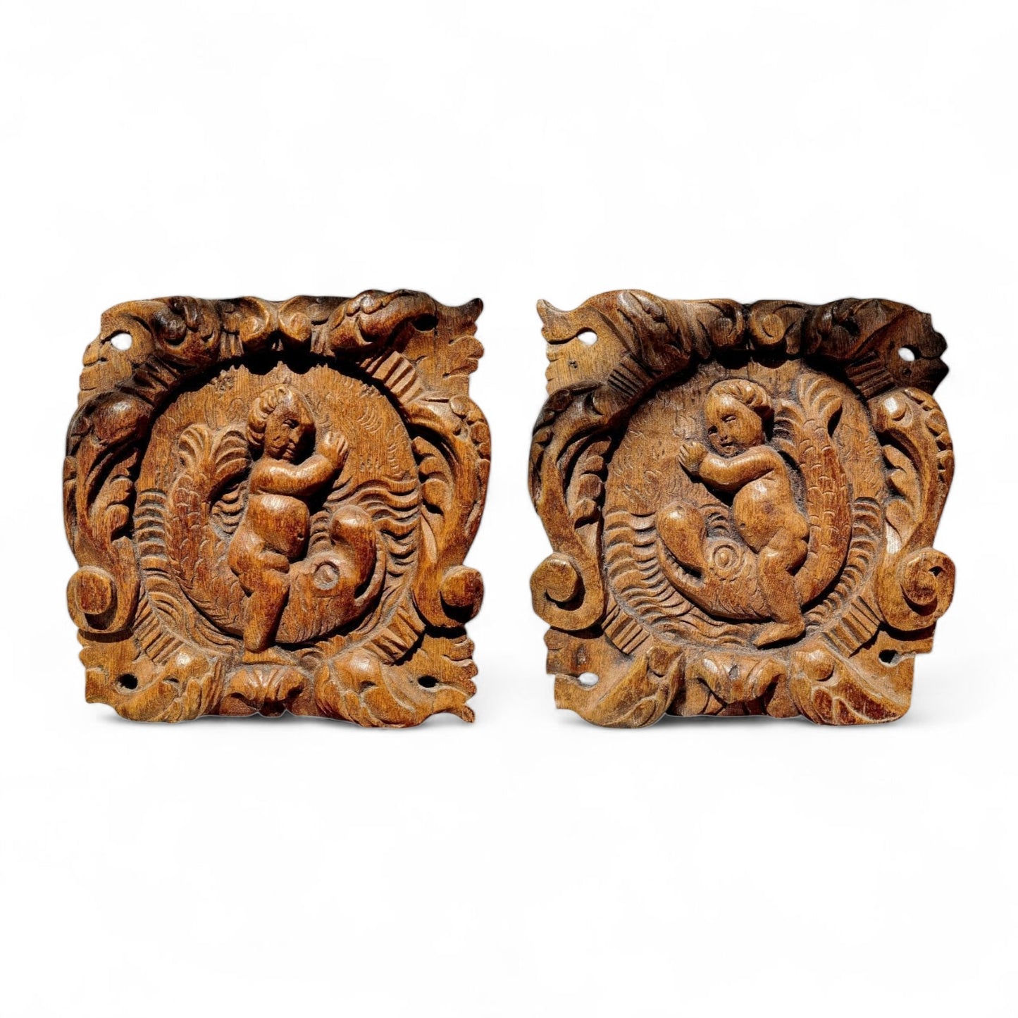 A Pair Of Charming 17th-Century Decorative Antique Carved Oak Panels Depicting Cherubs Riding Upon Sea Monsters