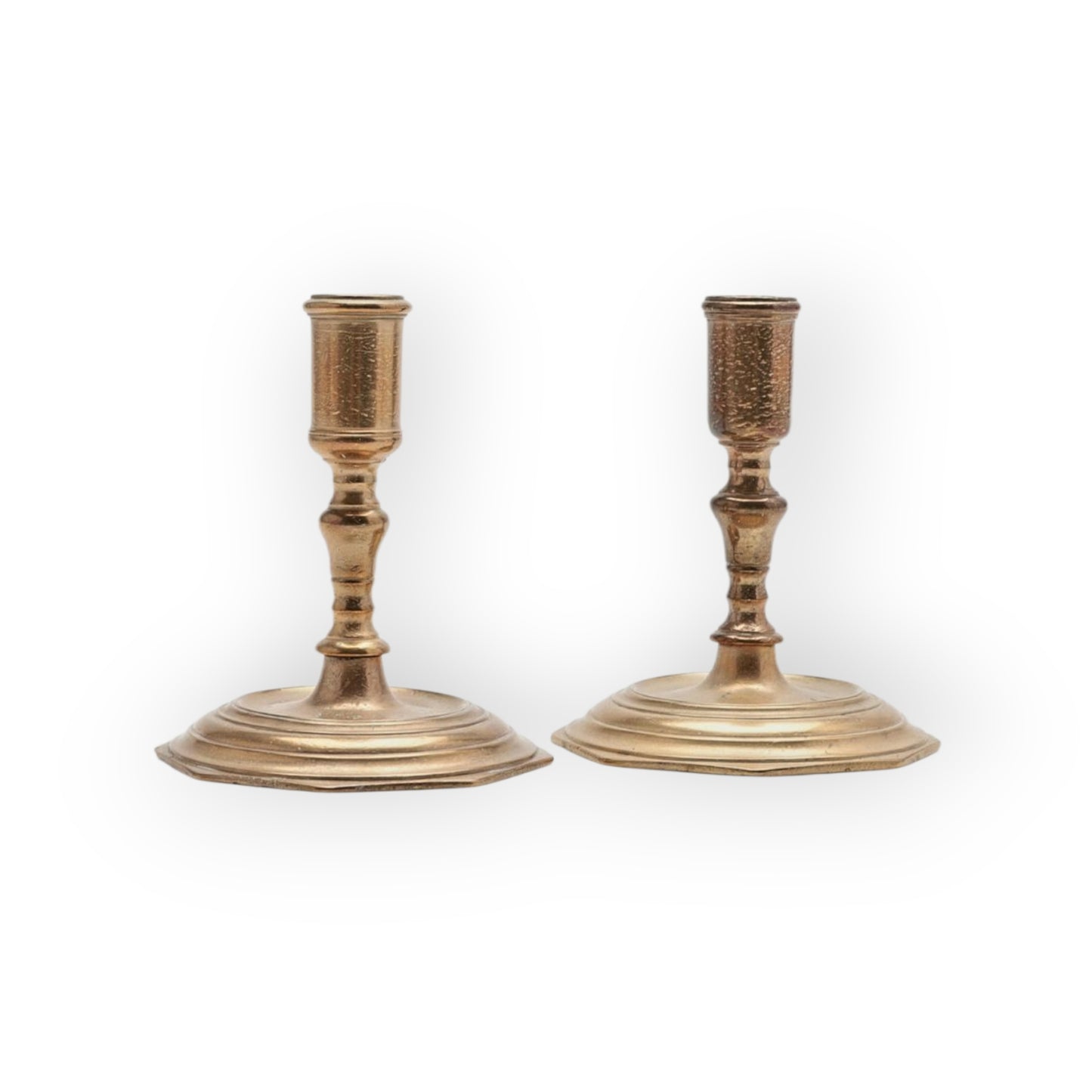A Pair Of Early 18th-Century Baroque Antique Brass Candlesticks Of Squat Form