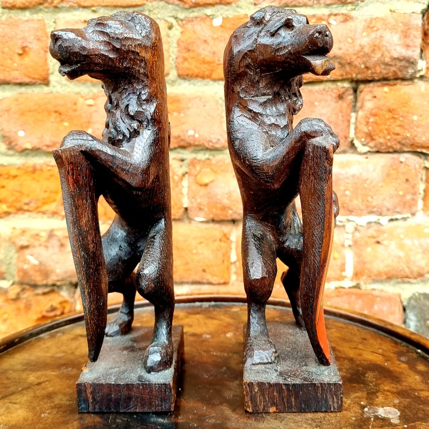Pair of 19th Century Gothic Revival Antique Carved Oak Rampant Lions Bearing Polychromed Shields with the Initials "R" & "H"