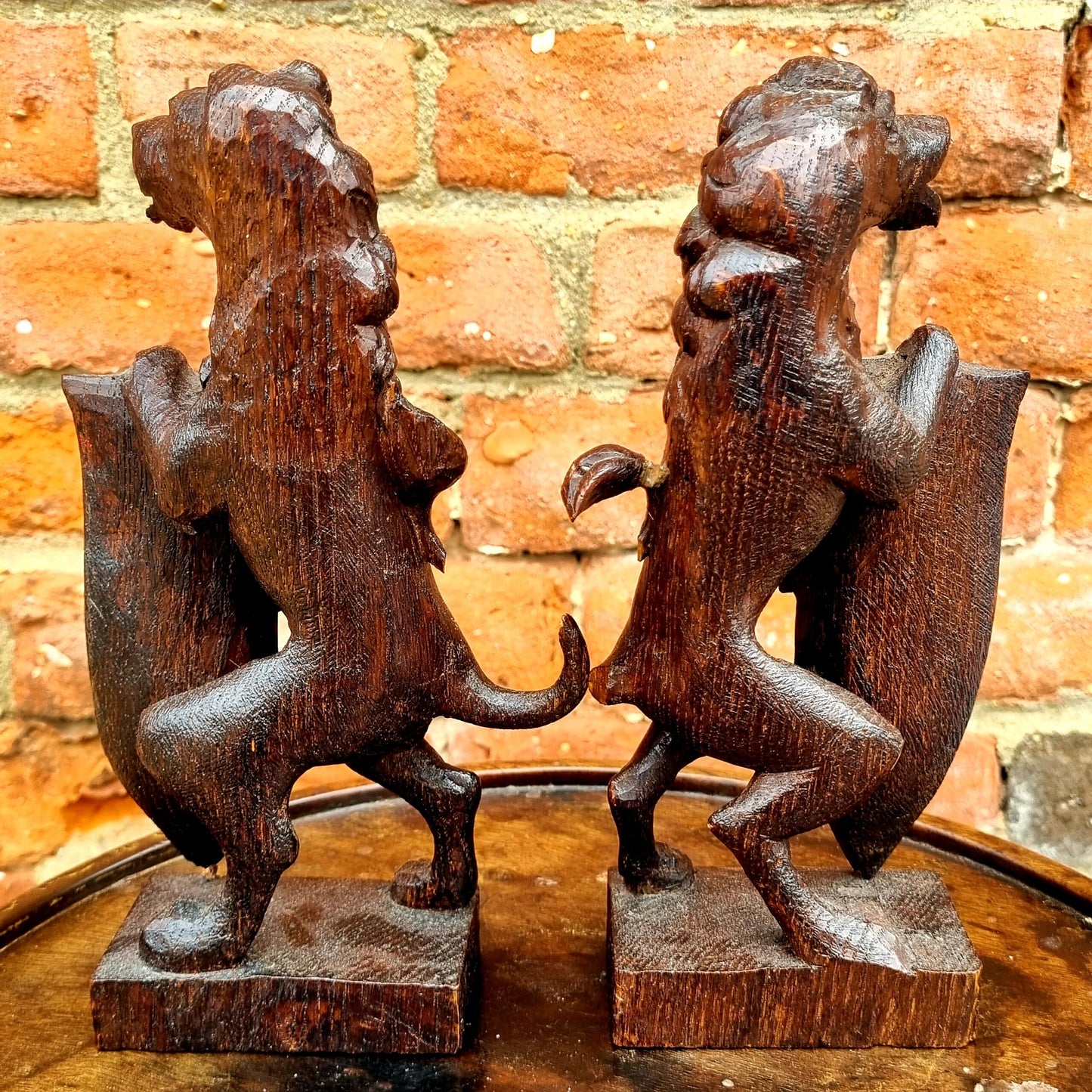 Pair of 19th Century Gothic Revival Antique Carved Oak Rampant Lions Bearing Polychromed Shields with the Initials "R" & "H"