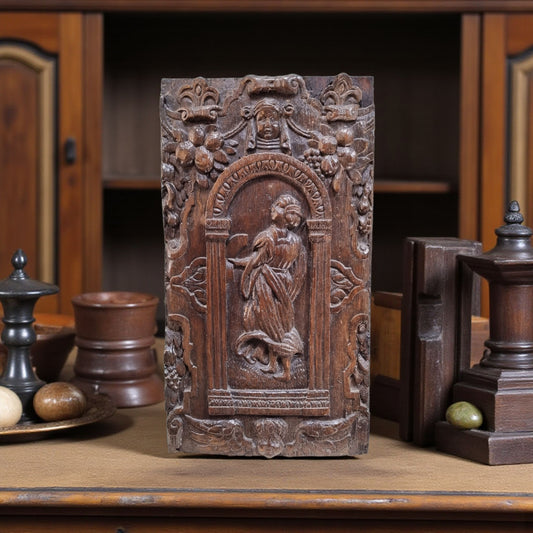 A late 16th-Century Antique Carved Oak Panel Depicting A Maiden Set Within An Arcaded Frieze