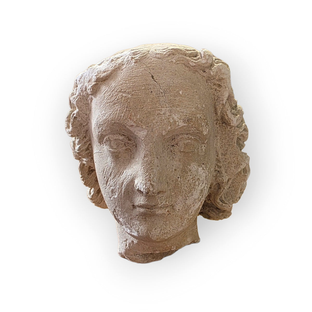 A 16th Century French Gothic Antique Carved Limestone Head of a Youth, probably an Angel or Youthful Saint, Attributed to Northern France, Troyes, Champagne, c.1500–1540