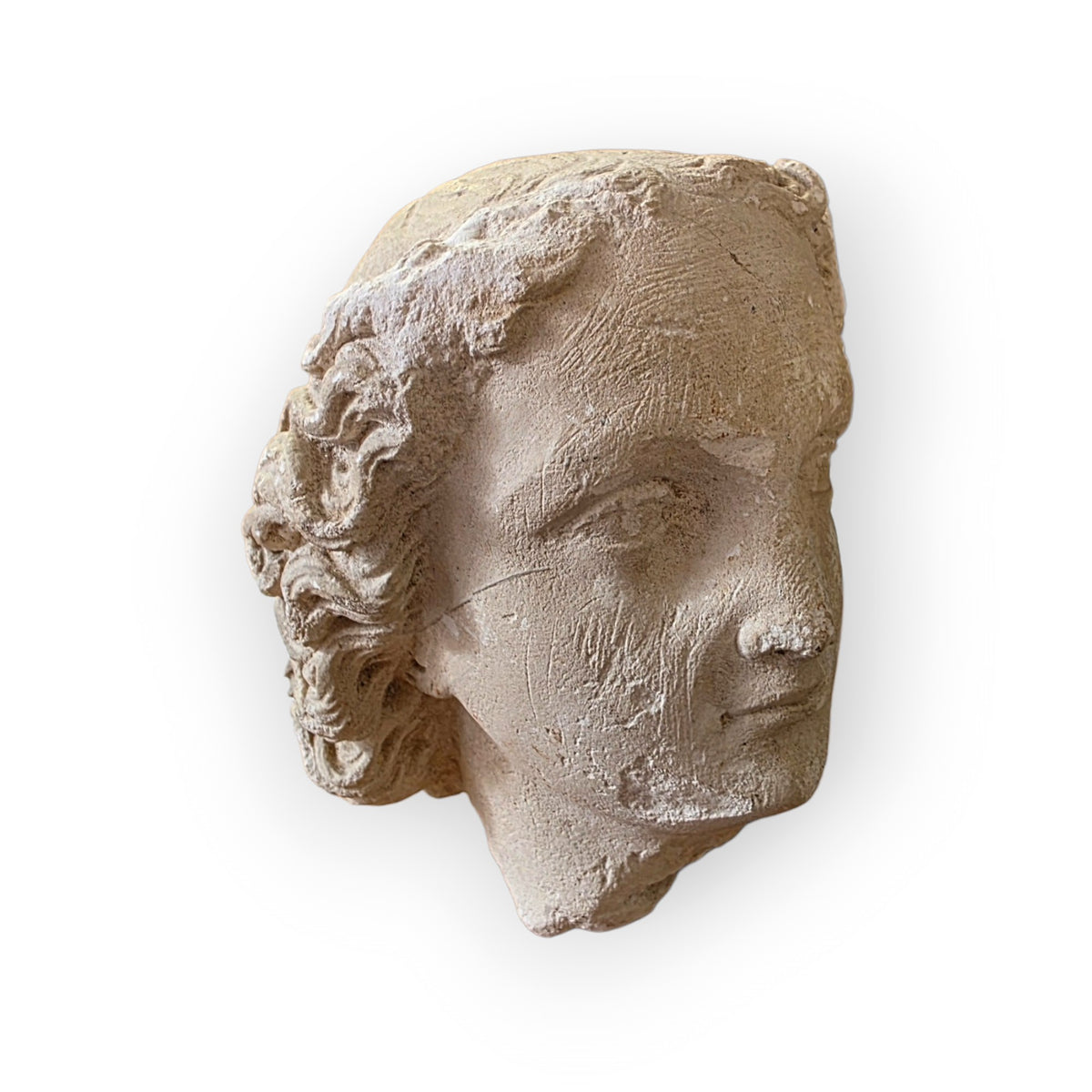 A 16th Century French Gothic Antique Carved Limestone Head of a Youth, probably an Angel or Youthful Saint, Attributed to Northern France, Troyes, Champagne, c.1500–1540