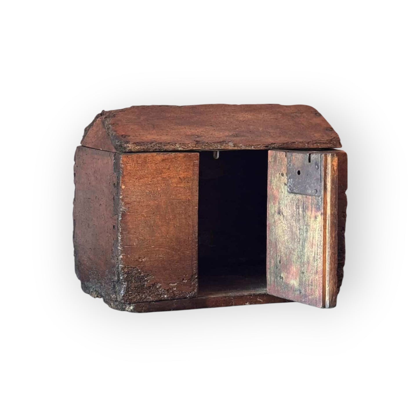 A small rustic wooden box with a slanted roof and one open door, shown against a plain white background.