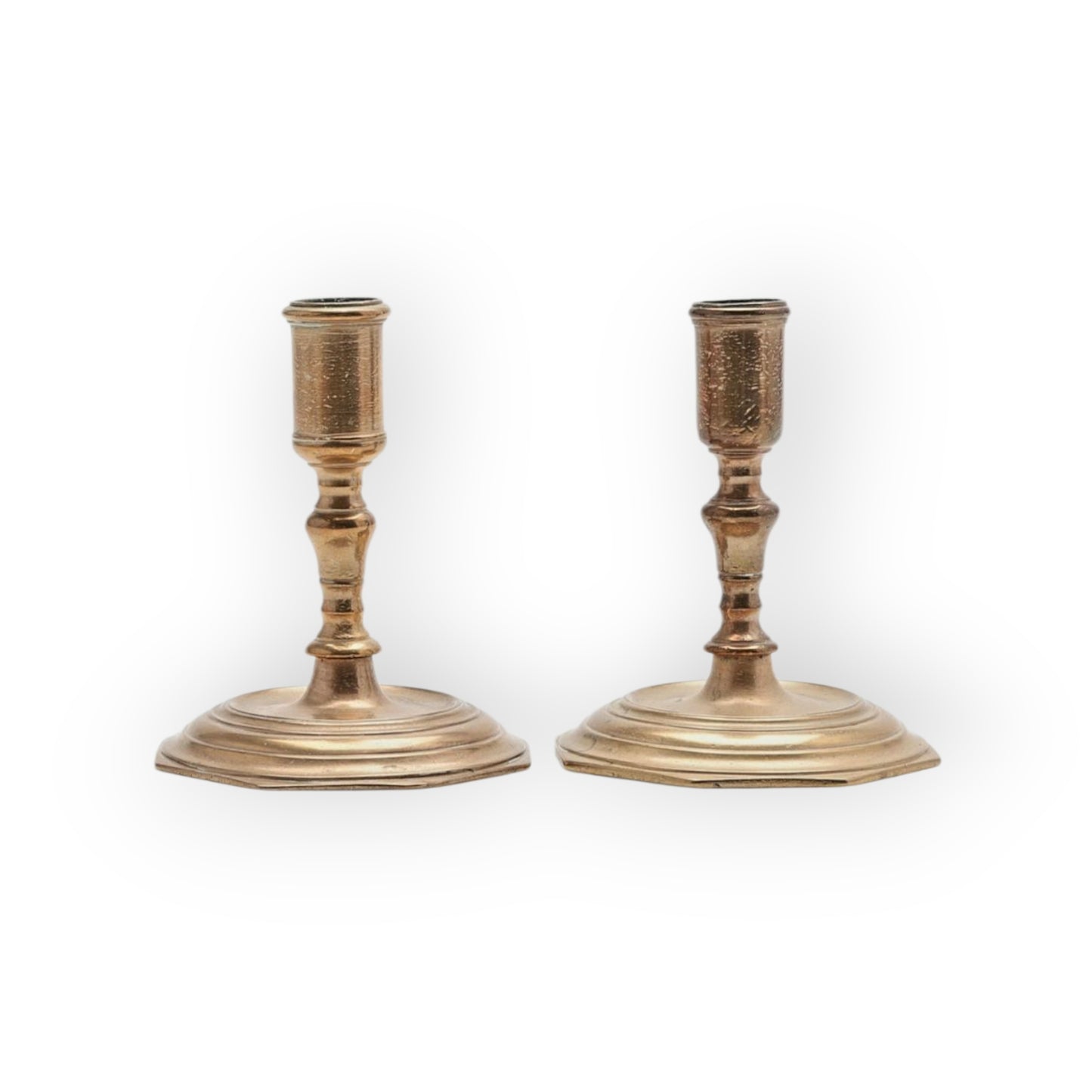 A Pair Of Early 18th-Century Baroque Antique Brass Candlesticks Of Squat Form