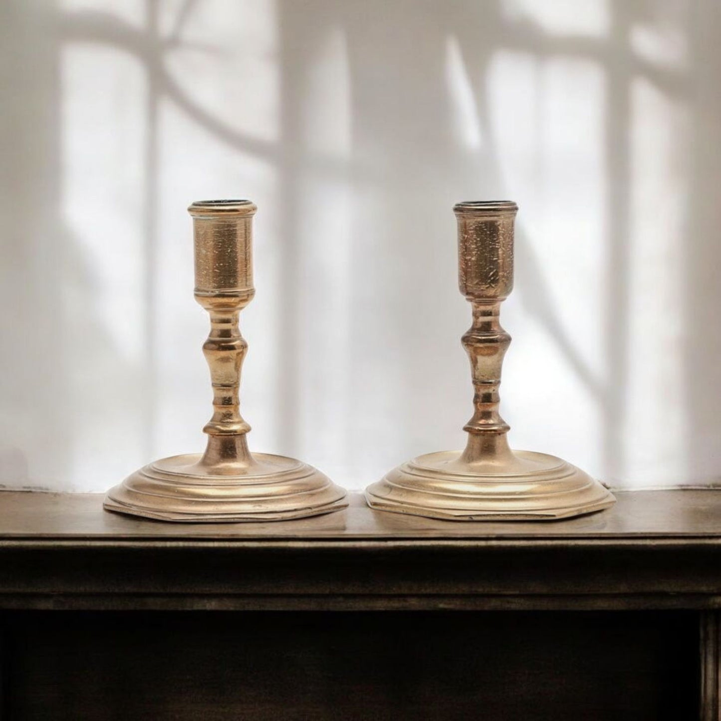 A Pair Of Early 18th-Century Baroque Antique Brass Candlesticks Of Squat Form