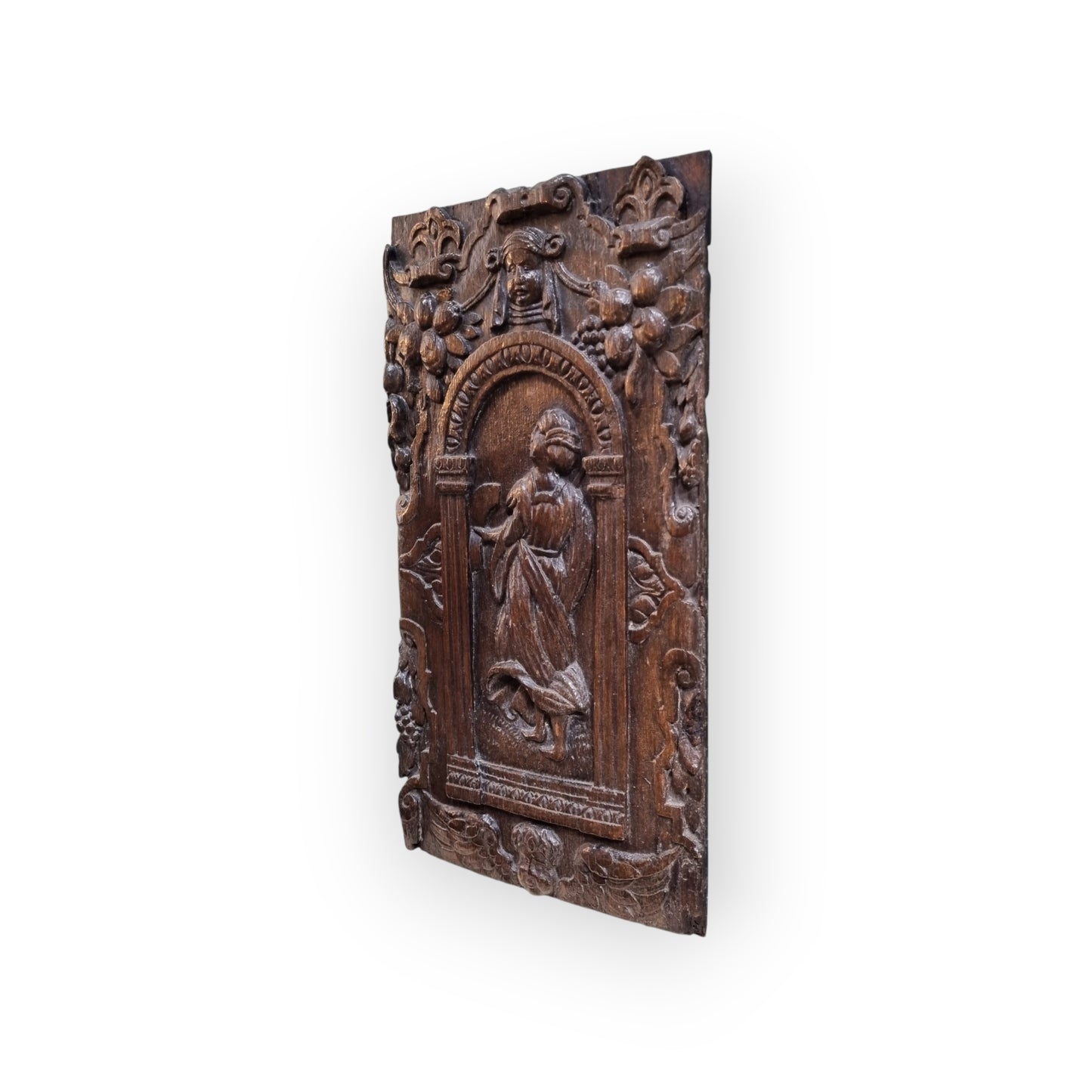 A late 16th-Century Antique Carved Oak Panel Depicting A Maiden Set Within An Arcaded Frieze