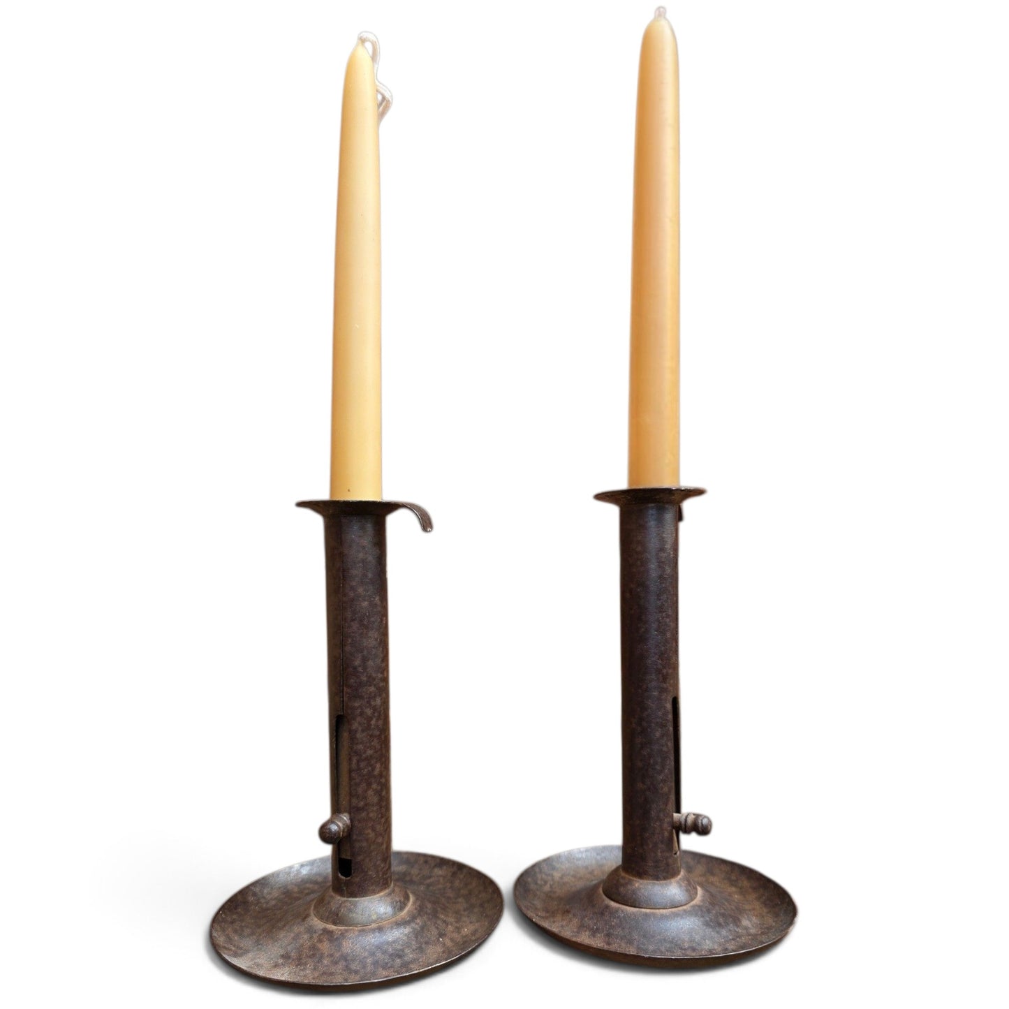 Holt Antiques at Walsingham Mill pair of adjustable dark iron candle holders with cream taper candles