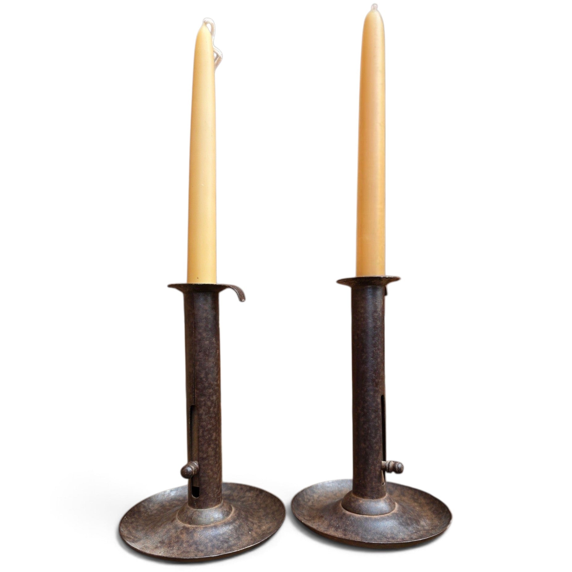 Holt Antiques at Walsingham Mill pair of adjustable dark iron candle holders with cream taper candles
