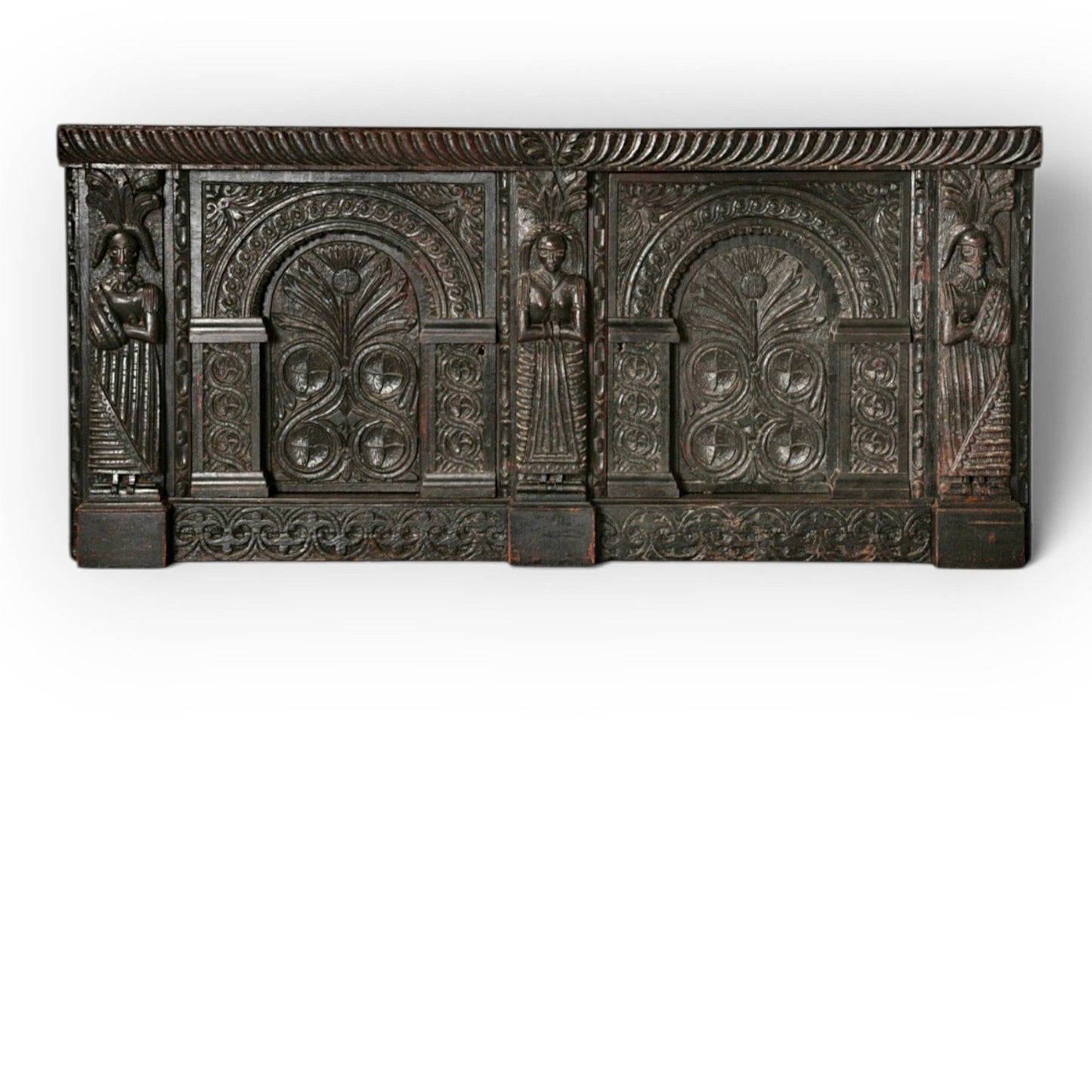 Holt Antiques at Walsingham Mill 17th-century dark oak wall panel featuring intricate hand-carved caryatids and arches.
