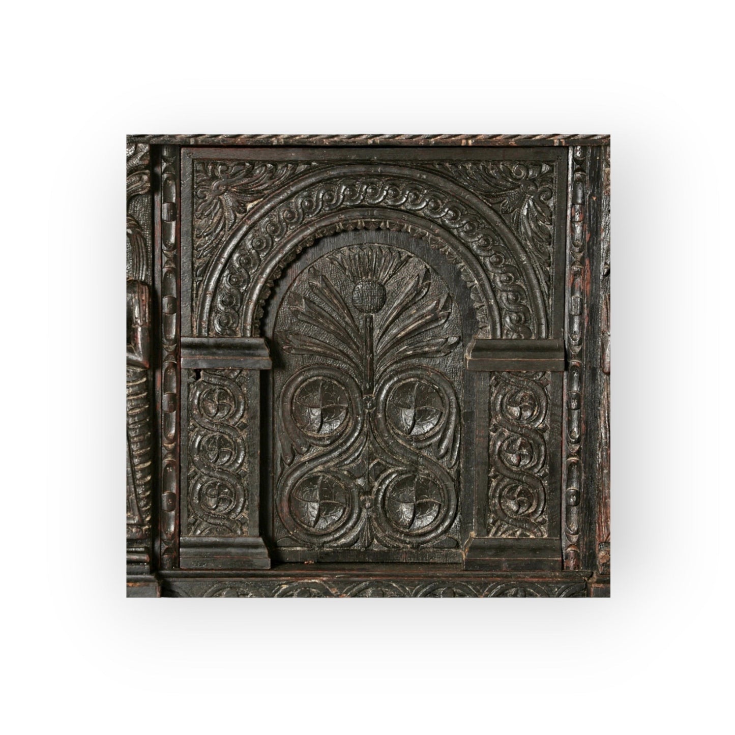 Holt Antiques at Walsingham Mill 17th century dark oak wall panel with intricate hand-carved arched floral motifs.