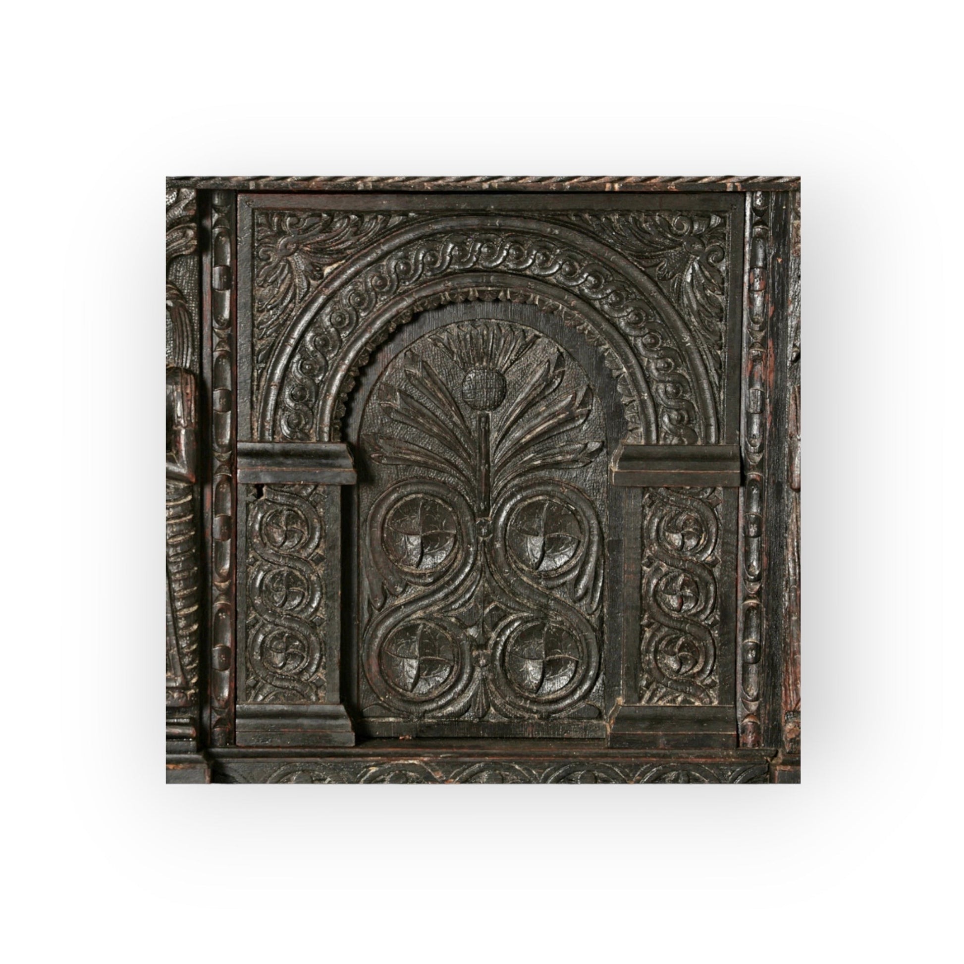 Holt Antiques at Walsingham Mill 17th century dark oak wall panel with intricate hand-carved arched floral motifs.
