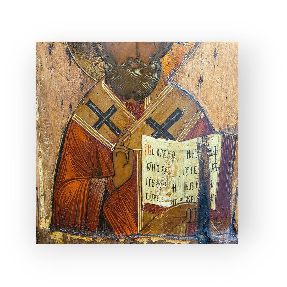 An Early 19th Century Antique Icon of Saint Nicholas the Wonderworker, Half-Length, Holding the Gospel
