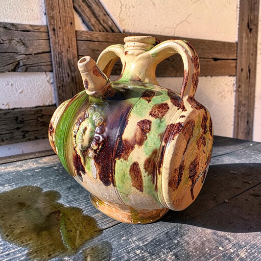 A Rare 17th Century French Saintonge Lead-Glazed Earthenware Costrel, Attributed to La Chapelle-des-Pots, With Applied Mask and Eagle Medallions, Circa 1600-1650