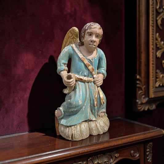 Early 18th‑century carved wooden angel in original polychrome with blue robe and gold sash