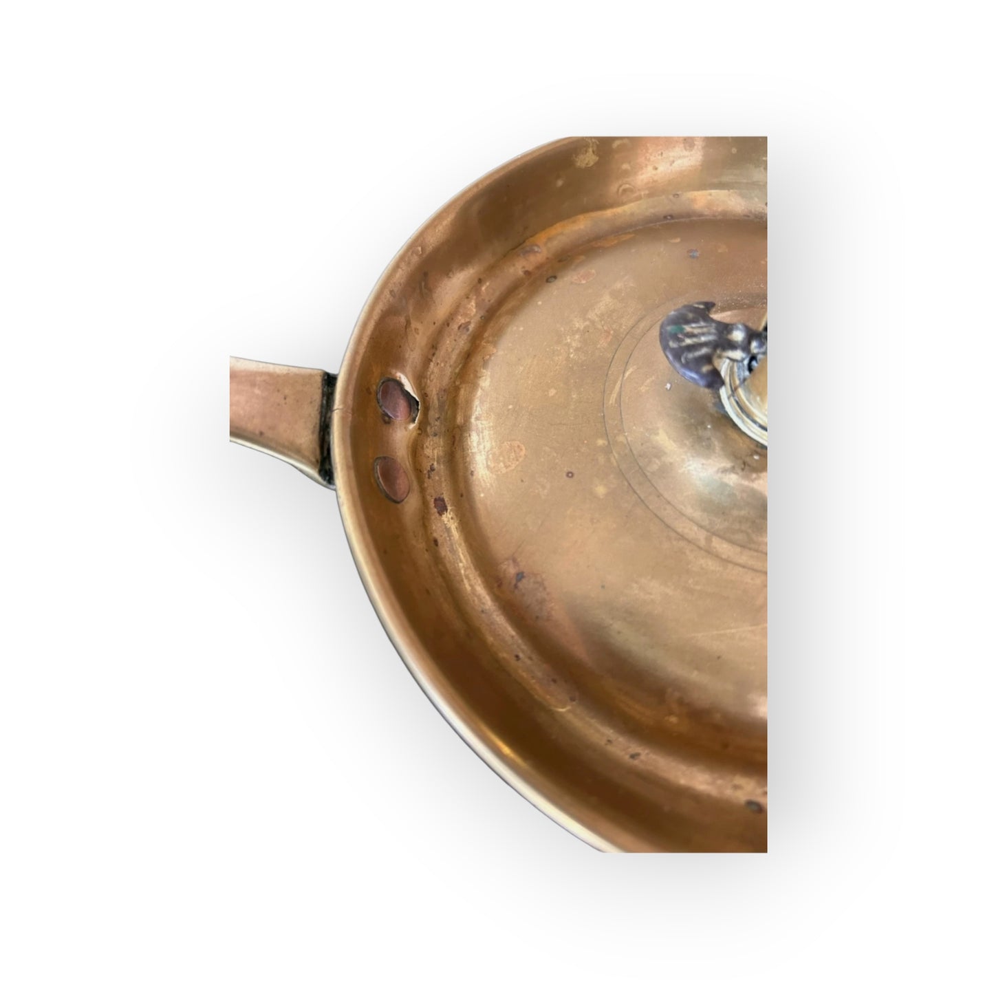 Detail of copper rivets securing handle to drip pan of Georgian brass chamberstick