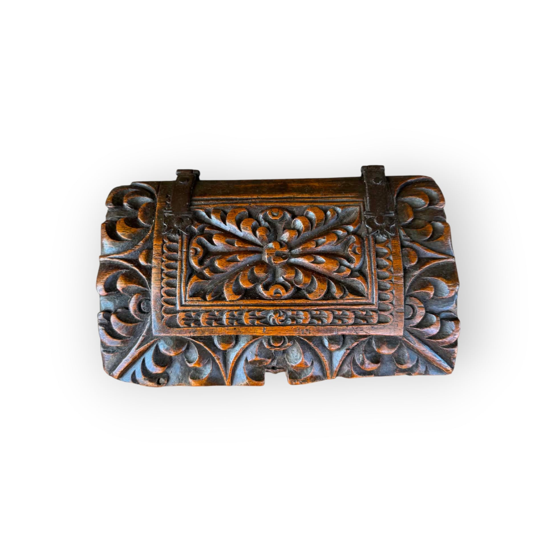 Central stylised flowerhead panel with scrolling foliage and iron strap hinges on 17th century Continental oak casket
