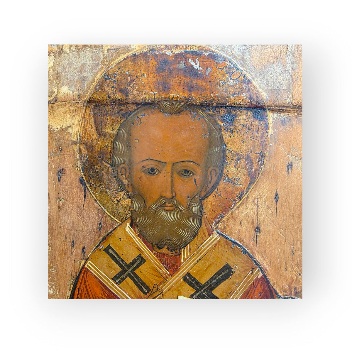 An Early 19th Century Antique Icon of Saint Nicholas the Wonderworker, Half-Length, Holding the Gospel