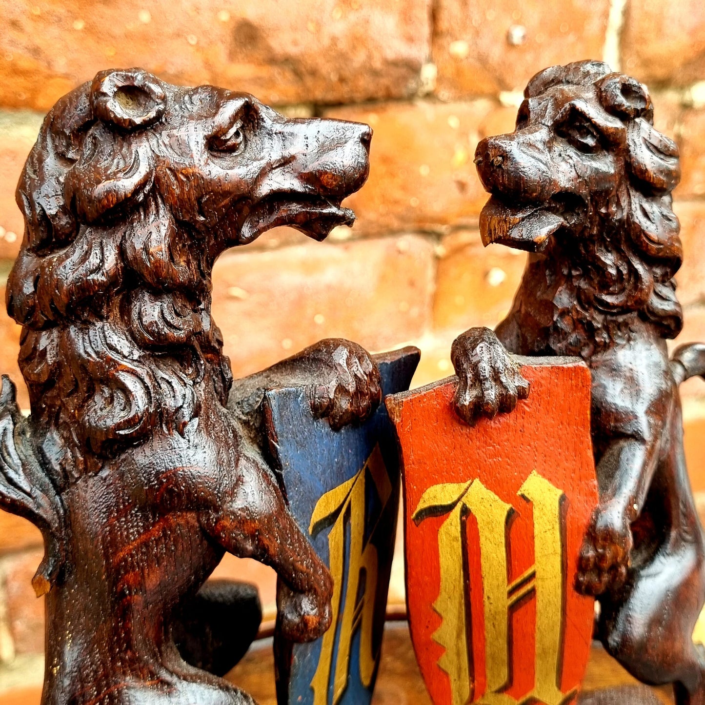 Pair of 19th Century Gothic Revival Antique Carved Oak Rampant Lions Bearing Polychromed Shields with the Initials "R" & "H"