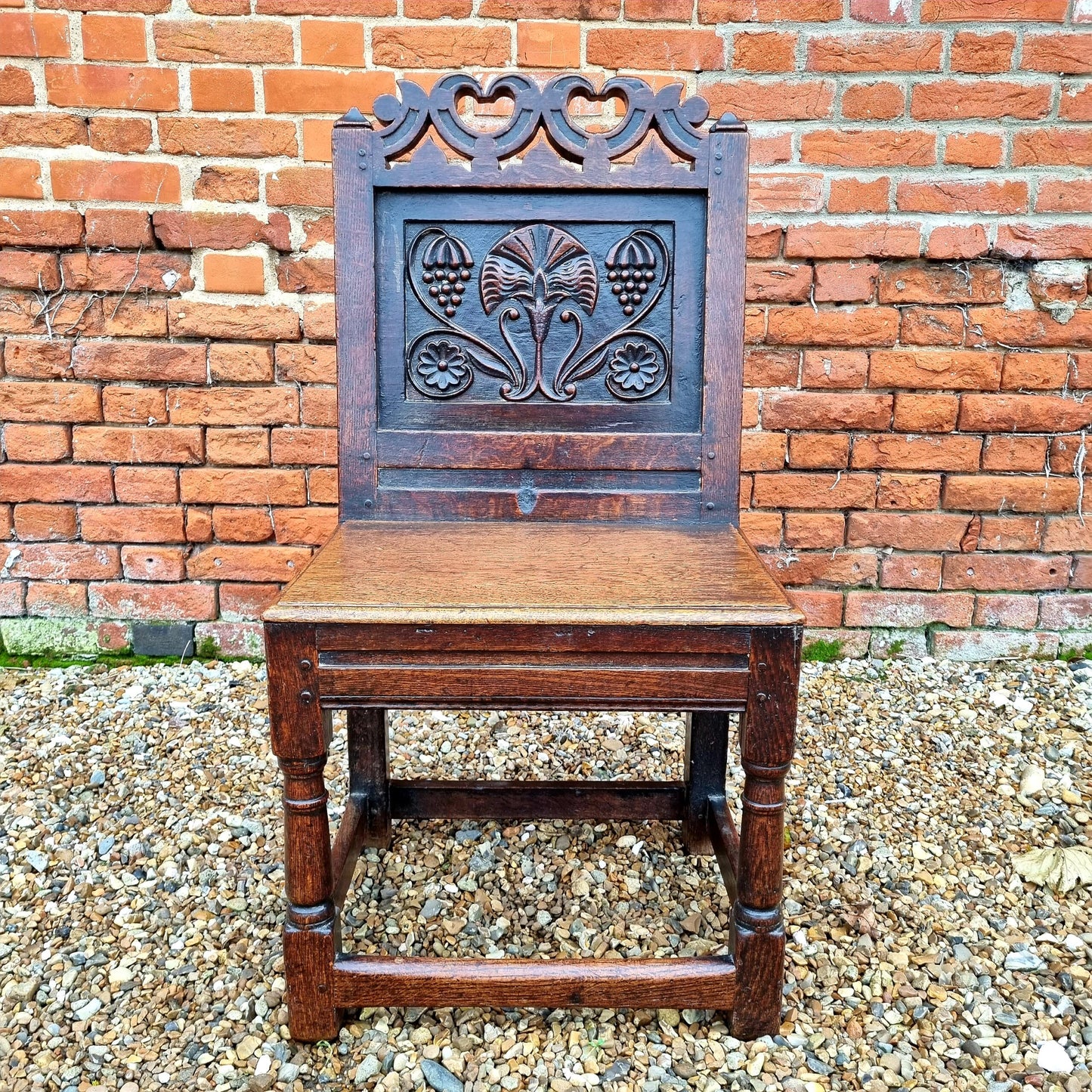 Mid 17th Century English Antique Oak Back Stool, Circa 1640. A similar example is held in the collection of the Victoria and Albert Museum, London