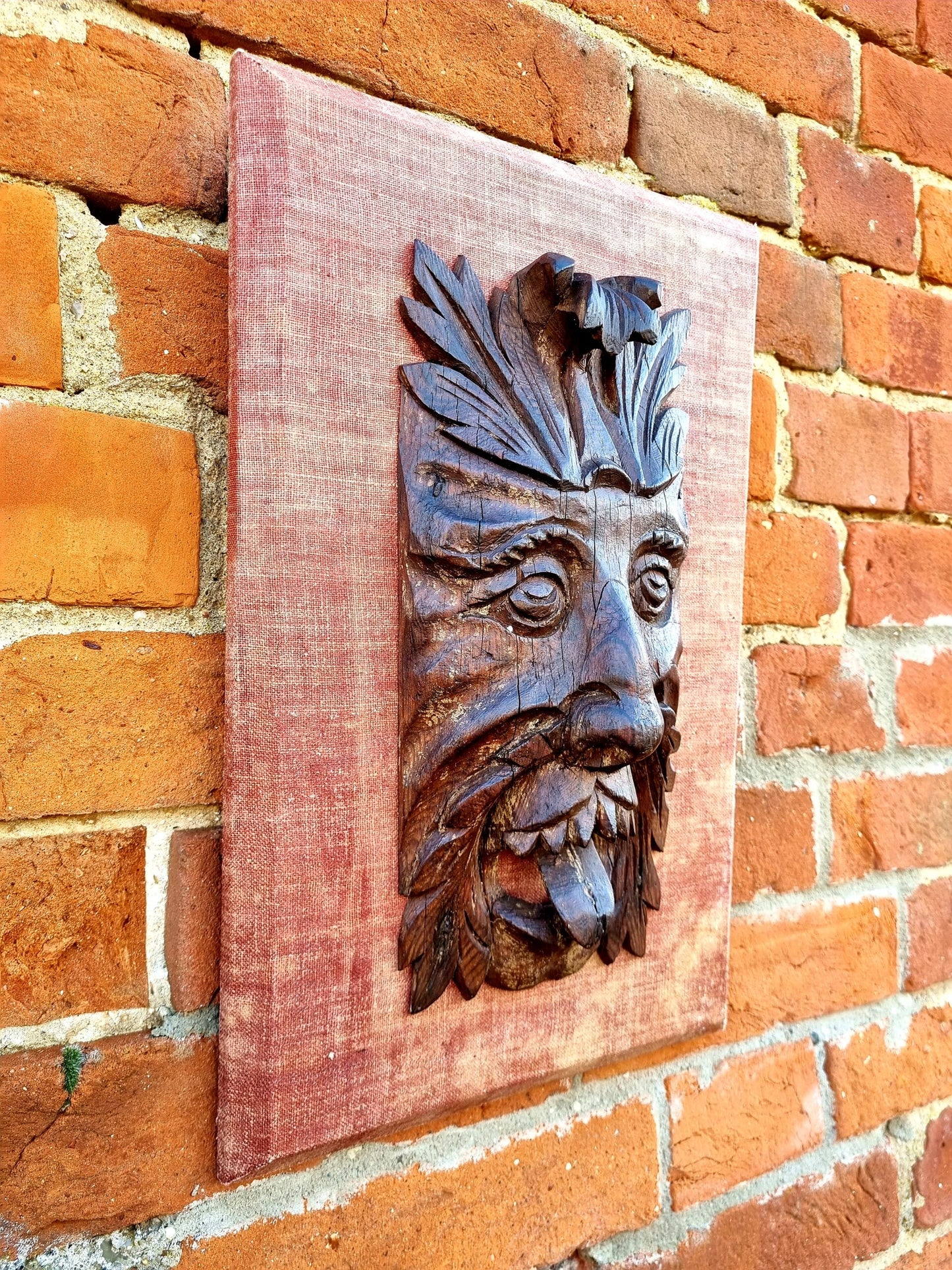A Late 17th Century / Early 18th Century English Antique Carved Pine Plaque in the Form of a Green Man